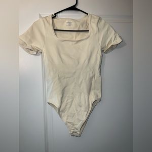 Amazon Off White Body Suit Size Medium **NEVER WORN**